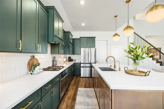 a view of a dining room with furniture a chandelier and wooden floor