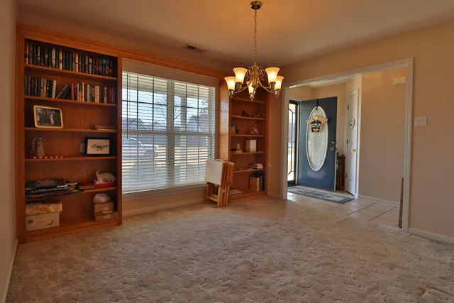 a view of a livingroom with a furniture and staircase