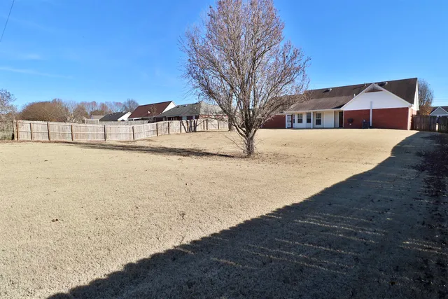a front view of a house with yard