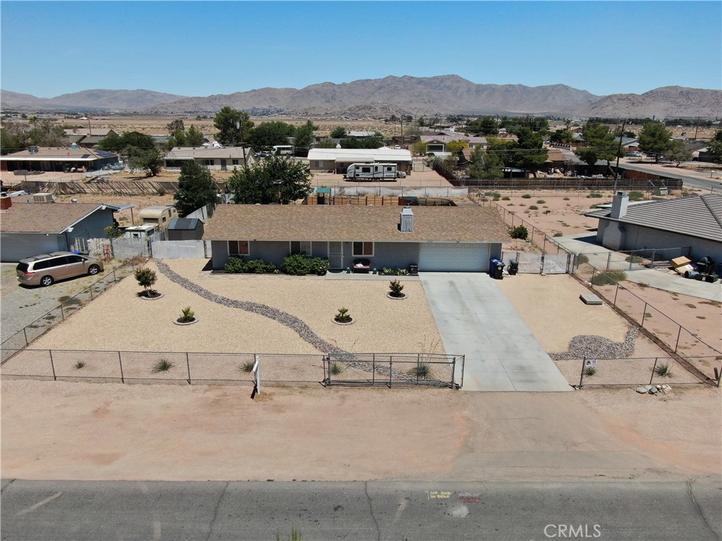 14529 Quivero Road Apple Valley, CA 92307 - Photo 1 of 1 an aerial view of a house with a yard