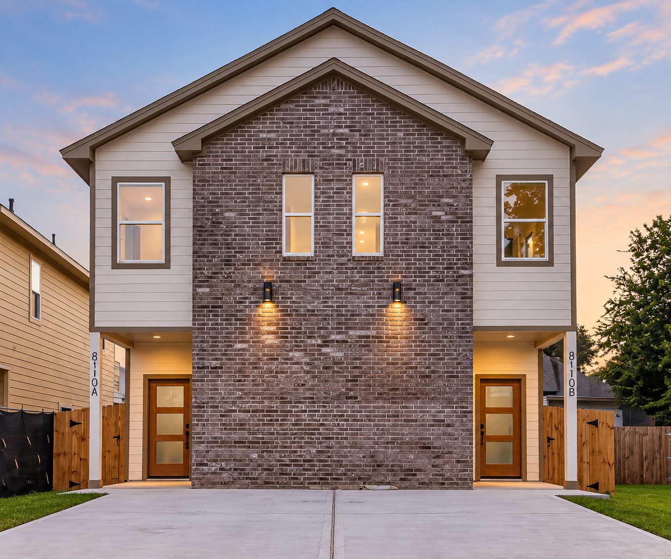 8110 Carver Road Houston, TX 77088 - Photo 1 of 38 Attractive two-story duplex featuring a brick façade, neutral exterior finishes, and separate private entrances for each unit.