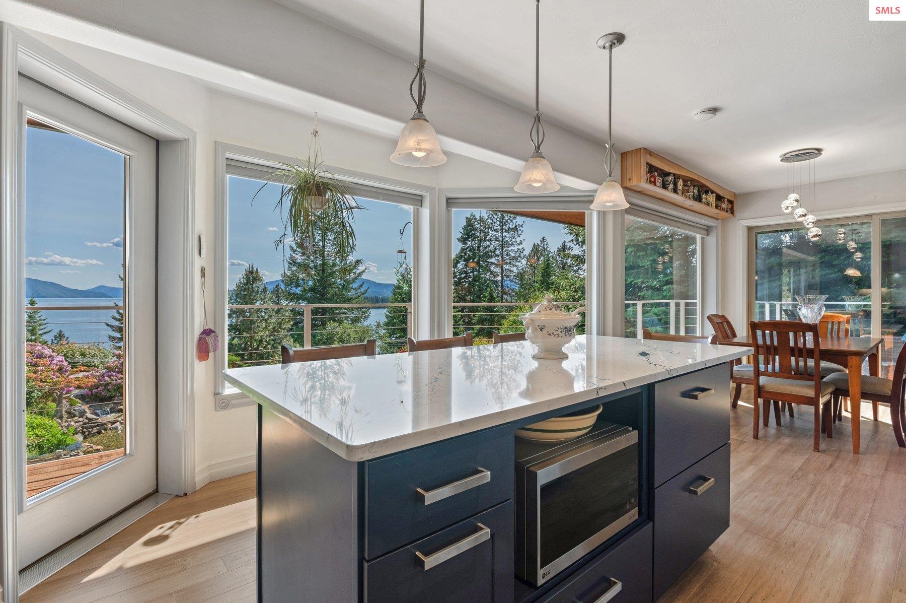 311 School Road Hope, ID 83836 - Photo 39 of 60 Expansive walls of glass frame panoramic vistas