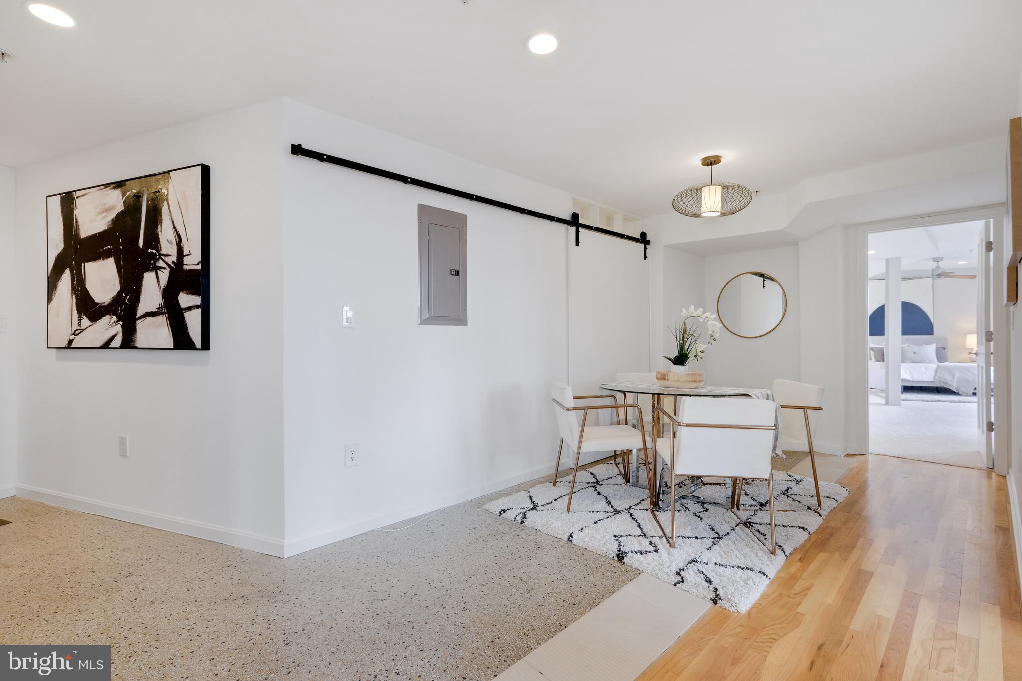 70 Rhode Island Avenue Northwest, Unit 502 Washington, DC 20001 - Photo 13 of 36 a view of a room with wooden floor and furniture