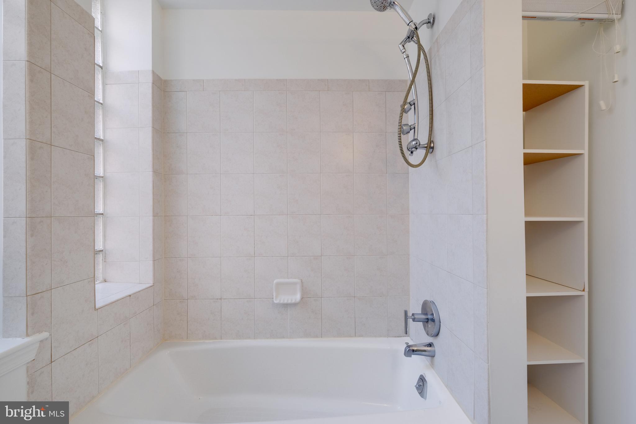 70 Rhode Island Avenue Northwest, Unit 502 Washington, DC 20001 - Photo 22 of 36 a bathroom with a shower and a tub