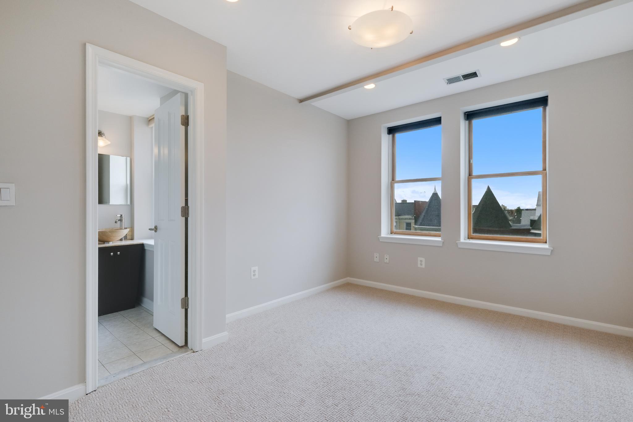 70 Rhode Island Avenue Northwest, Unit 502 Washington, DC 20001 - Photo 24 of 36 an empty room with windows and closet