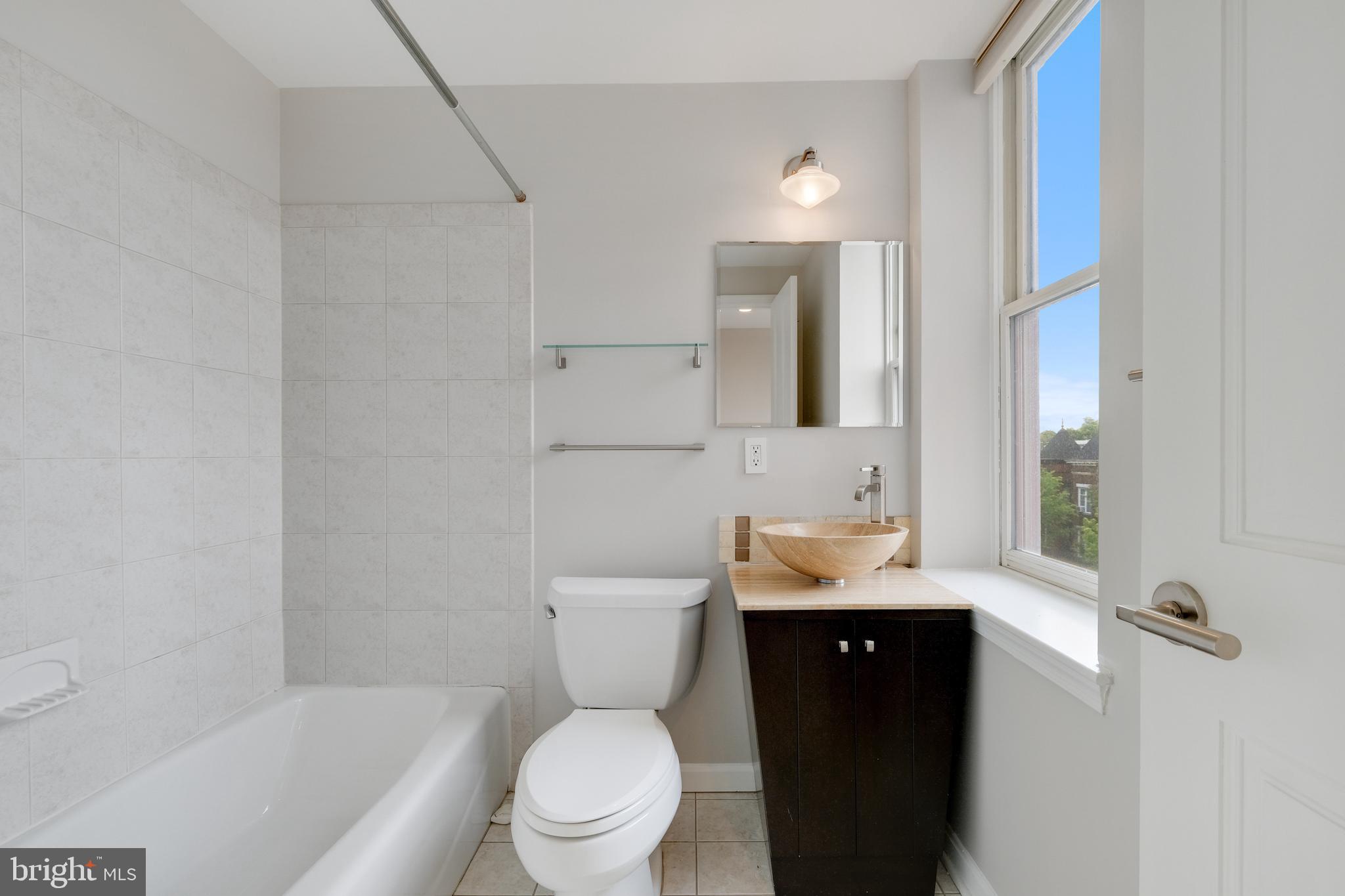 70 Rhode Island Avenue Northwest, Unit 502 Washington, DC 20001 - Photo 25 of 36 a bathroom with a sink toilet and shower