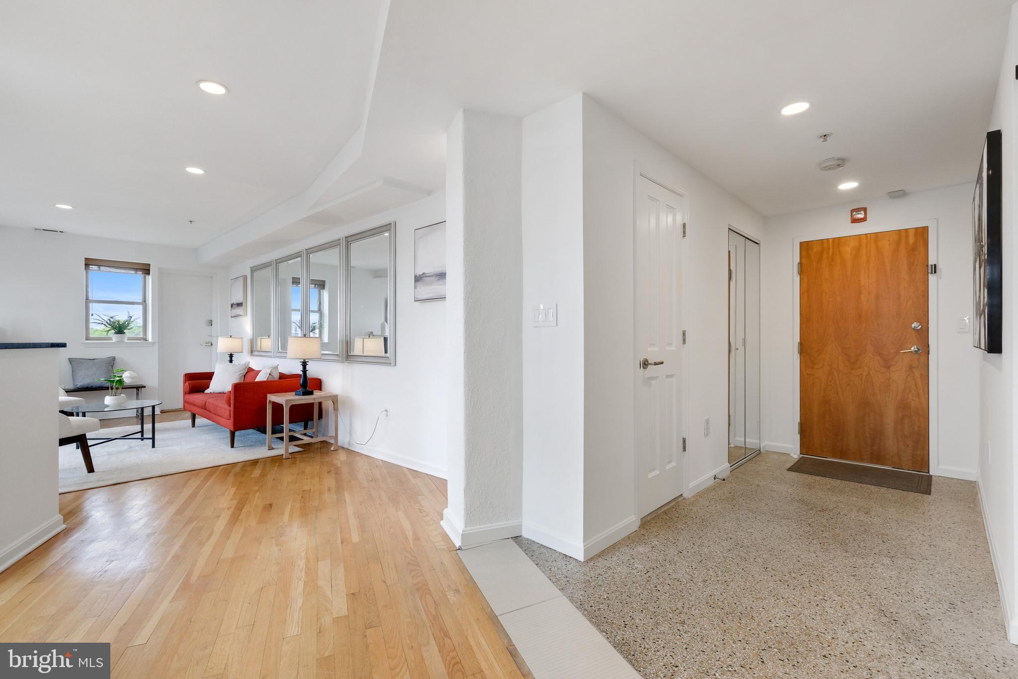 70 Rhode Island Avenue Northwest, Unit 502 Washington, DC 20001 - Photo 4 of 36 a living room with furniture and a chandelier