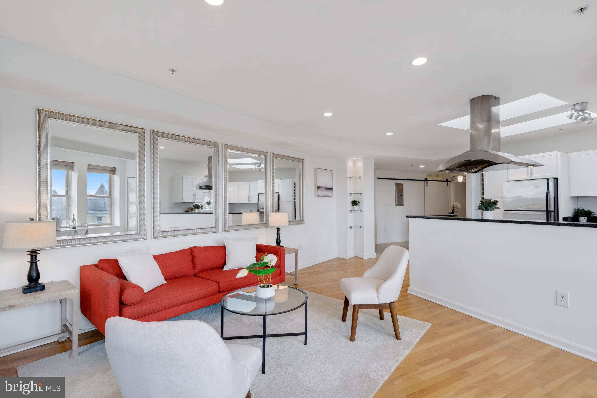 70 Rhode Island Avenue Northwest, Unit 502 Washington, DC 20001 - Photo 8 of 36 a living room with furniture and kitchen view
