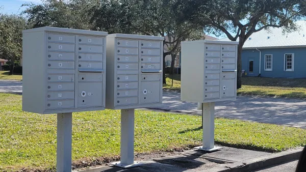 a view of a house with a large window and a yard