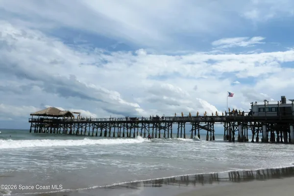 a view of a roof with sitting area