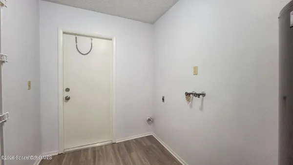 a view of a room with racks on the wall