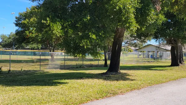 a view of swimming pool with a yard
