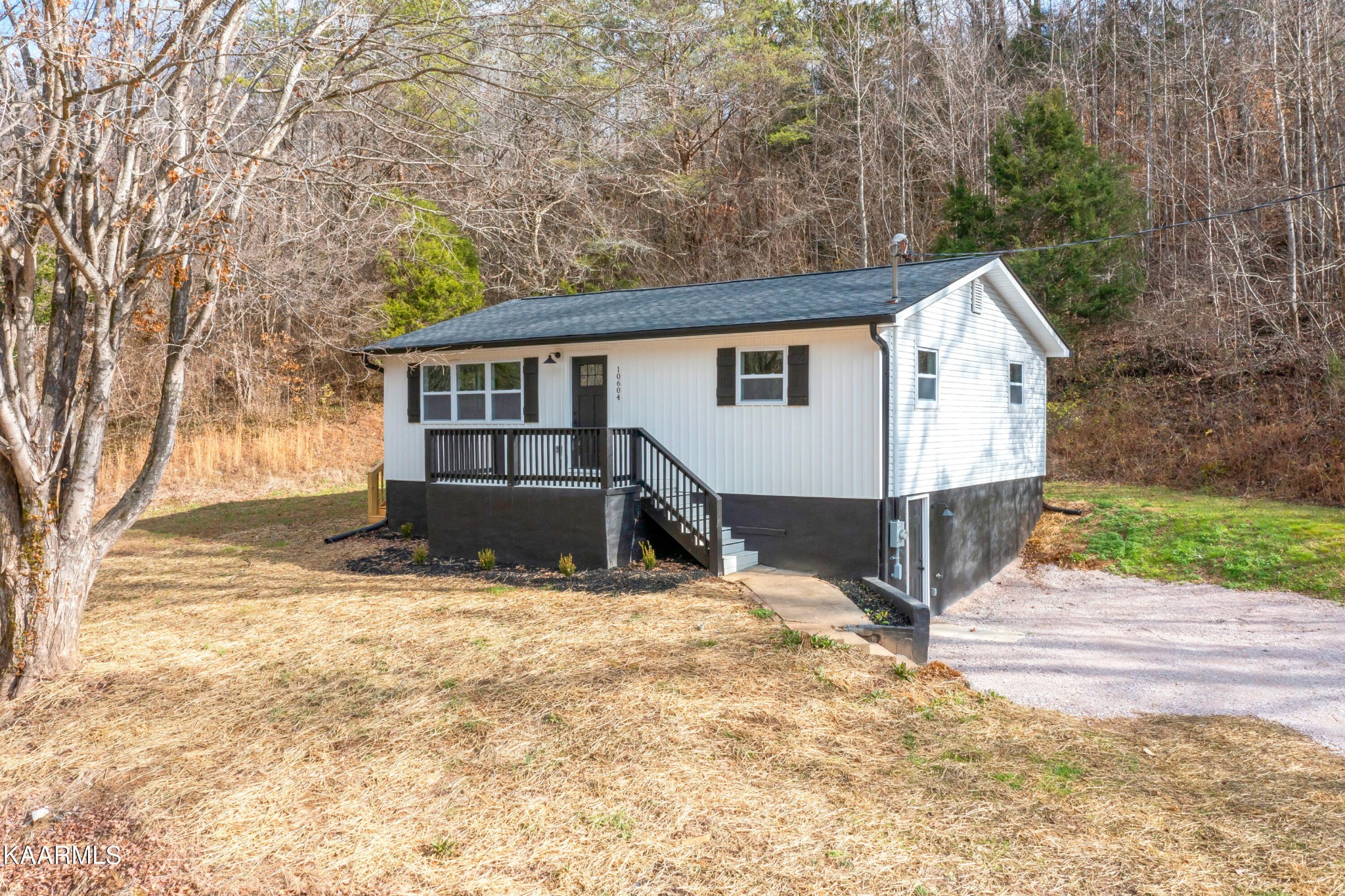 10604 Rutledge Pike Corryton, TN 37721 - Photo 1 of 19 a view of a house with a yard covered in snow