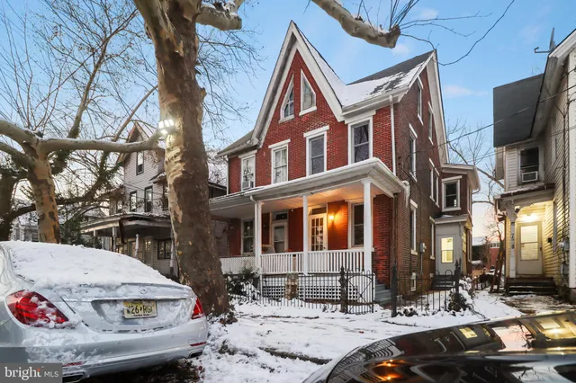 a view of a brick building with many windows