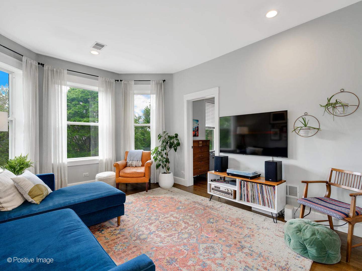 3903 North Seeley Avenue, Unit 3 Chicago, IL 60618 - Photo 3 of 20 a living room with furniture and a flat screen tv