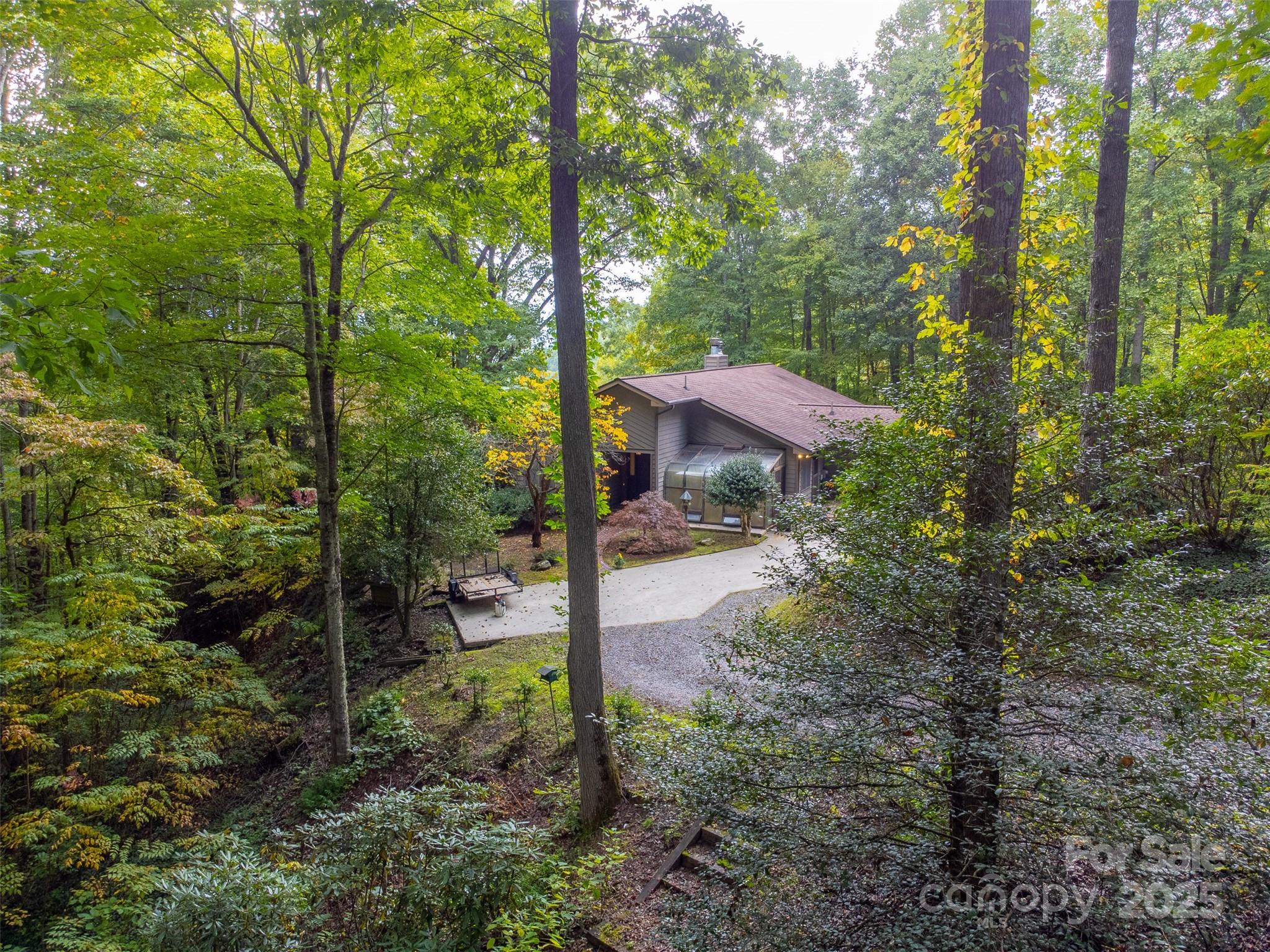 831 Forest Run Road Whittier, NC 28789 - Photo 25 of 29 a view of a house with a yard