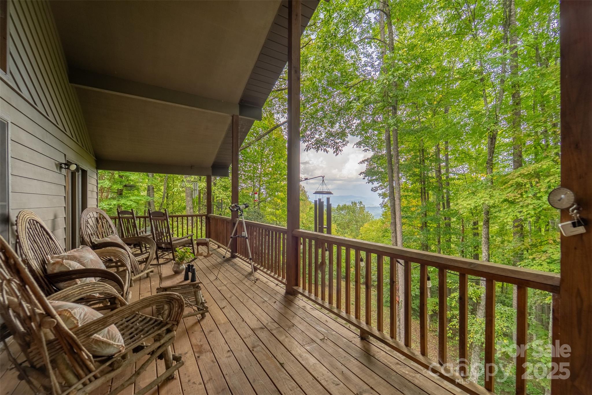 831 Forest Run Road Whittier, NC 28789 - Photo 5 of 29 a view of balcony with furniture and garden