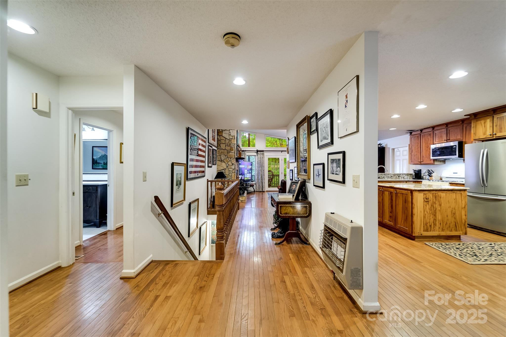 831 Forest Run Road Whittier, NC 28789 - Photo 7 of 29 a view of a kitchen with furniture and wooden floor