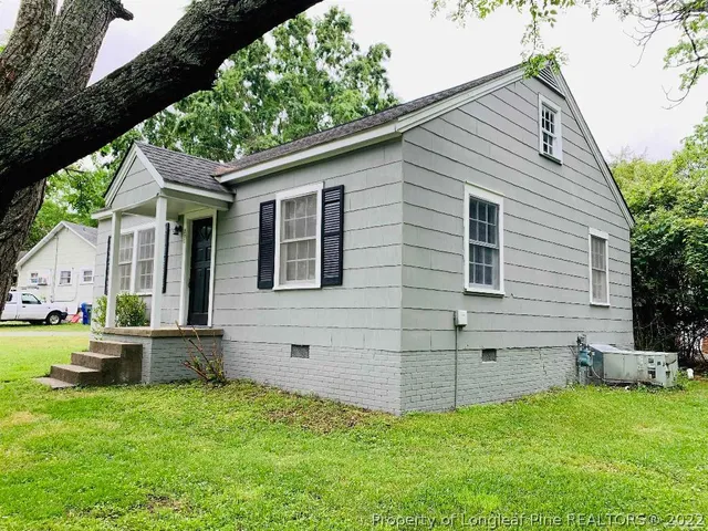 a view of backyard with a garden and entertaining space