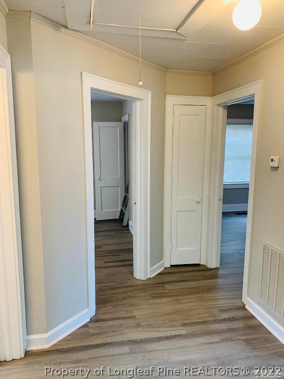 203 Hillsborough Road Carrboro, NC 27510 - Photo 7 of 12 a view of a hallway with wooden floor