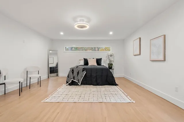 a bedroom with a bed and a table