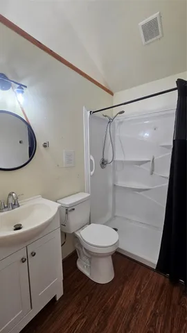 a bathroom with a sink toilet a mirror and vanity