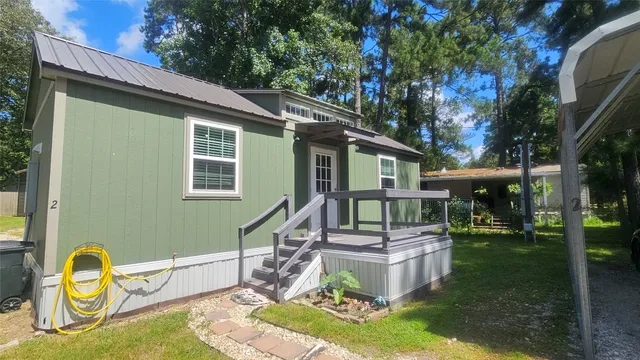 a backyard of a house with barbeque oven