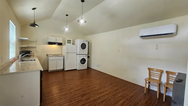a kitchen with stainless steel appliances a refrigerator and a stove top oven