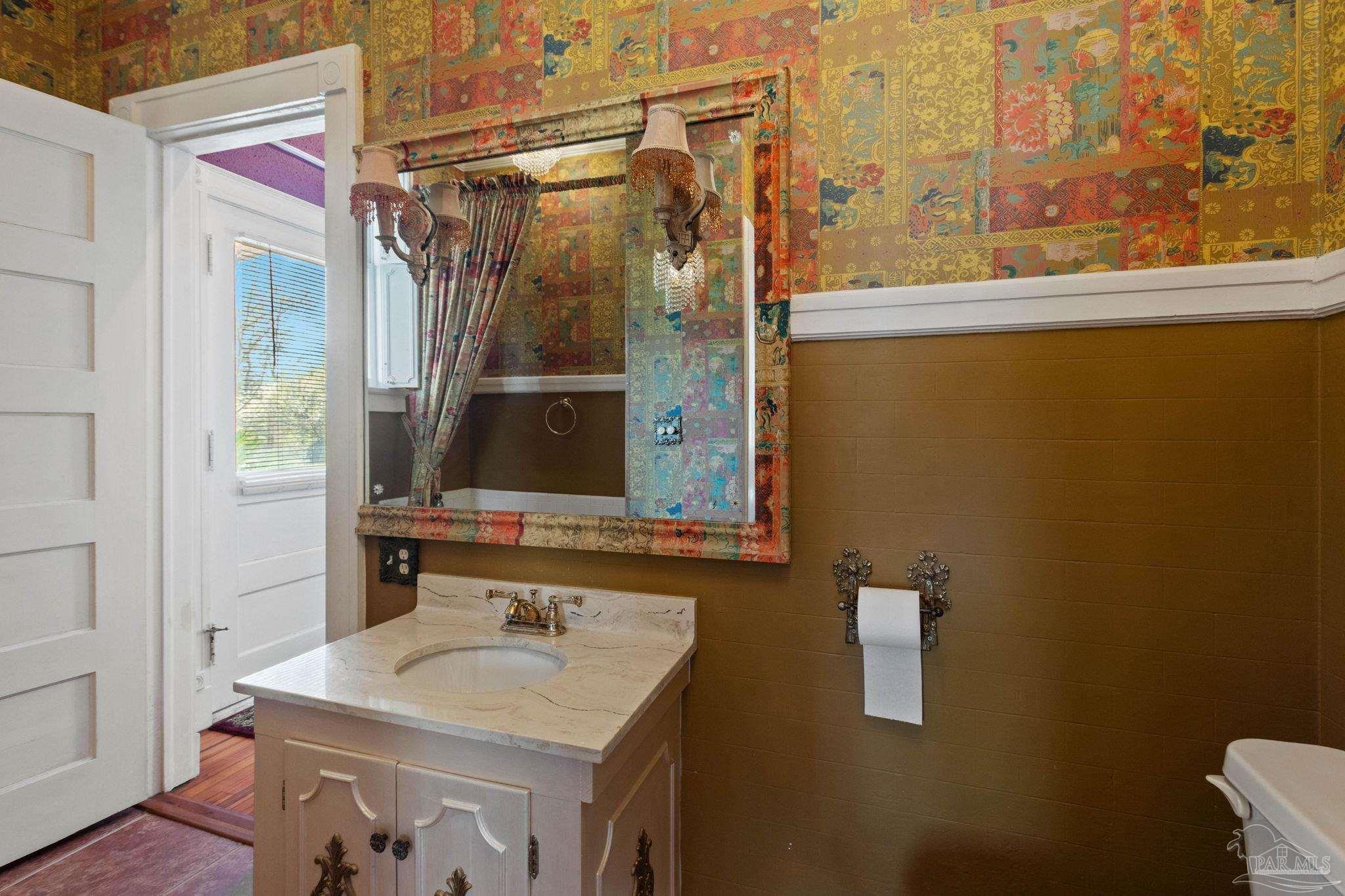 1701 Sowell Road Brewton, AL 36426 - Photo 52 of 72 a bathroom with a sink and a mirror