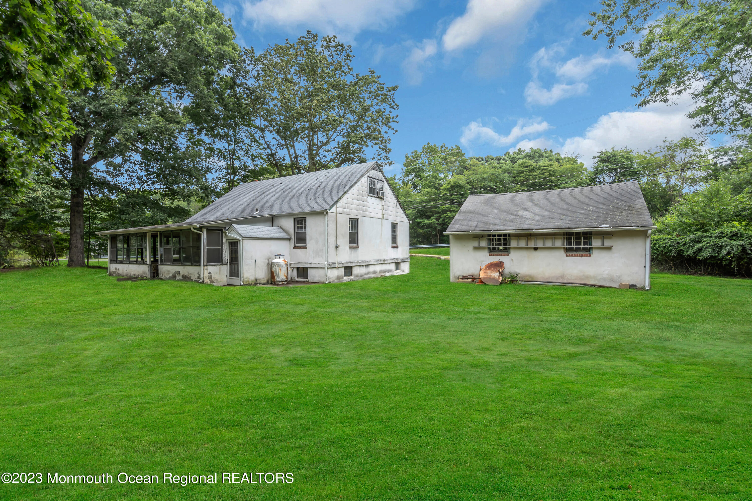 a front view of house with yard and green space