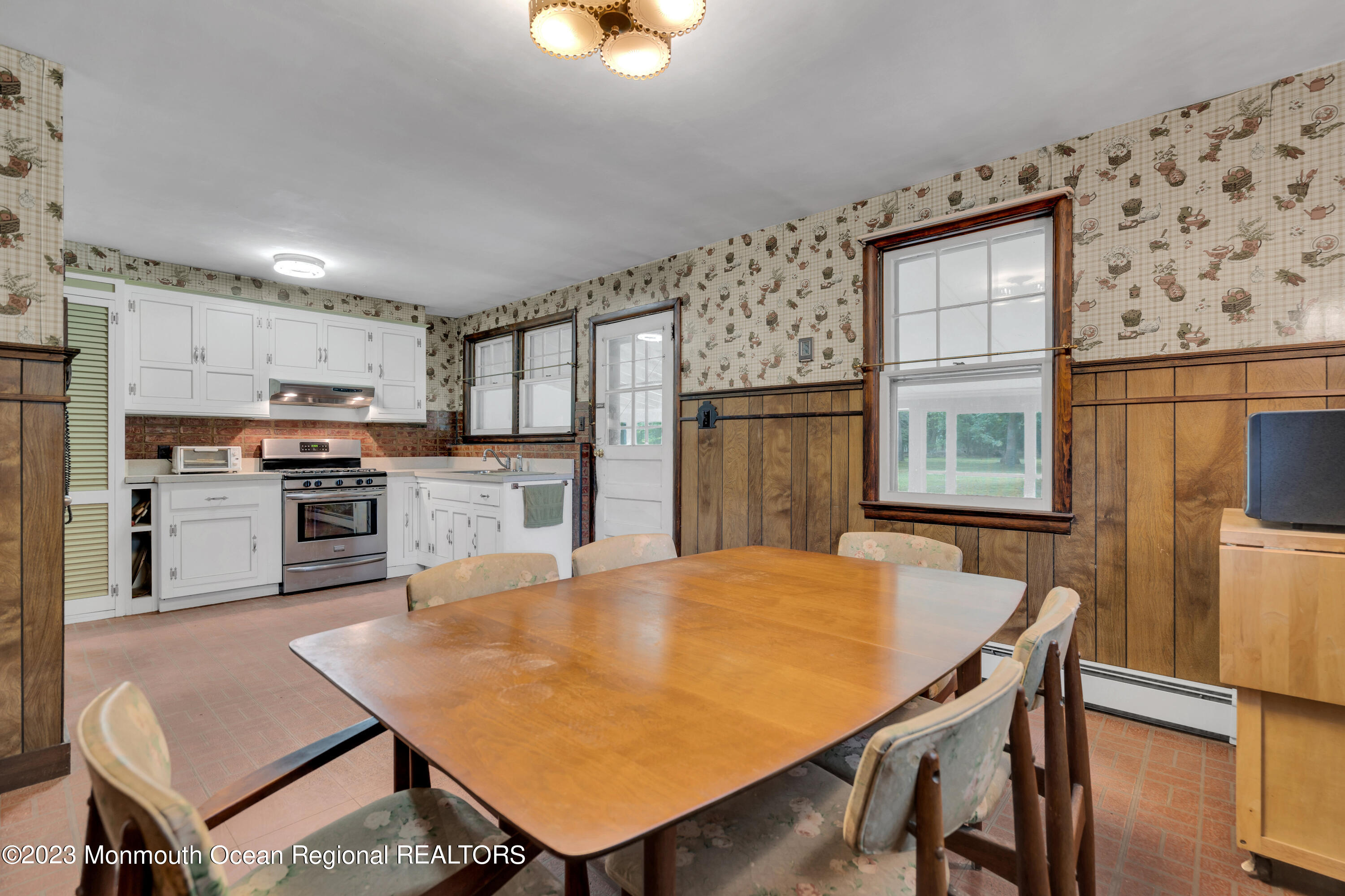 674 Harmony Road Jackson, NJ 08527 - Photo 12 of 43 a kitchen with stainless steel appliances granite countertop a stove a refrigerator a kitchen island a table and chairs