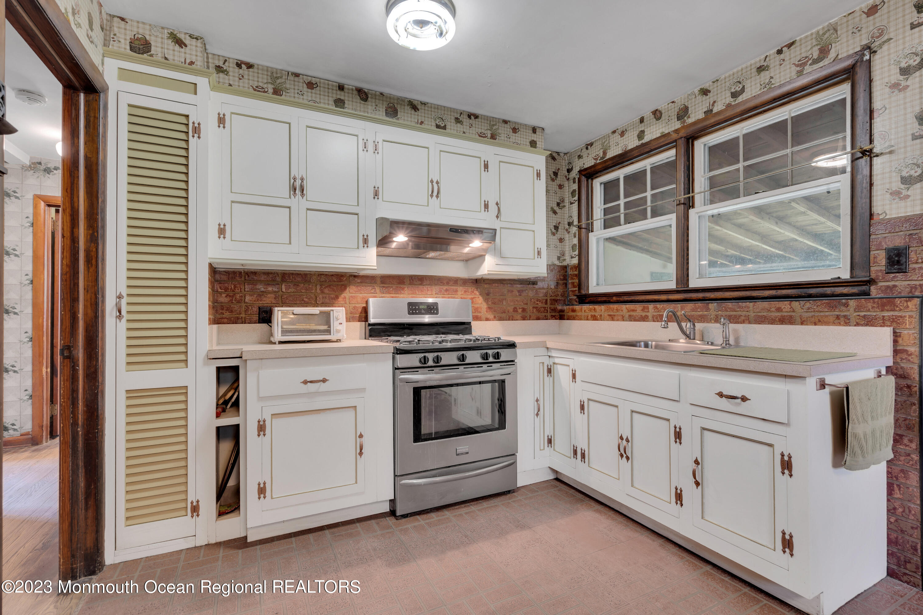 674 Harmony Road Jackson, NJ 08527 - Photo 14 of 43 a kitchen with granite countertop white cabinets and white appliances