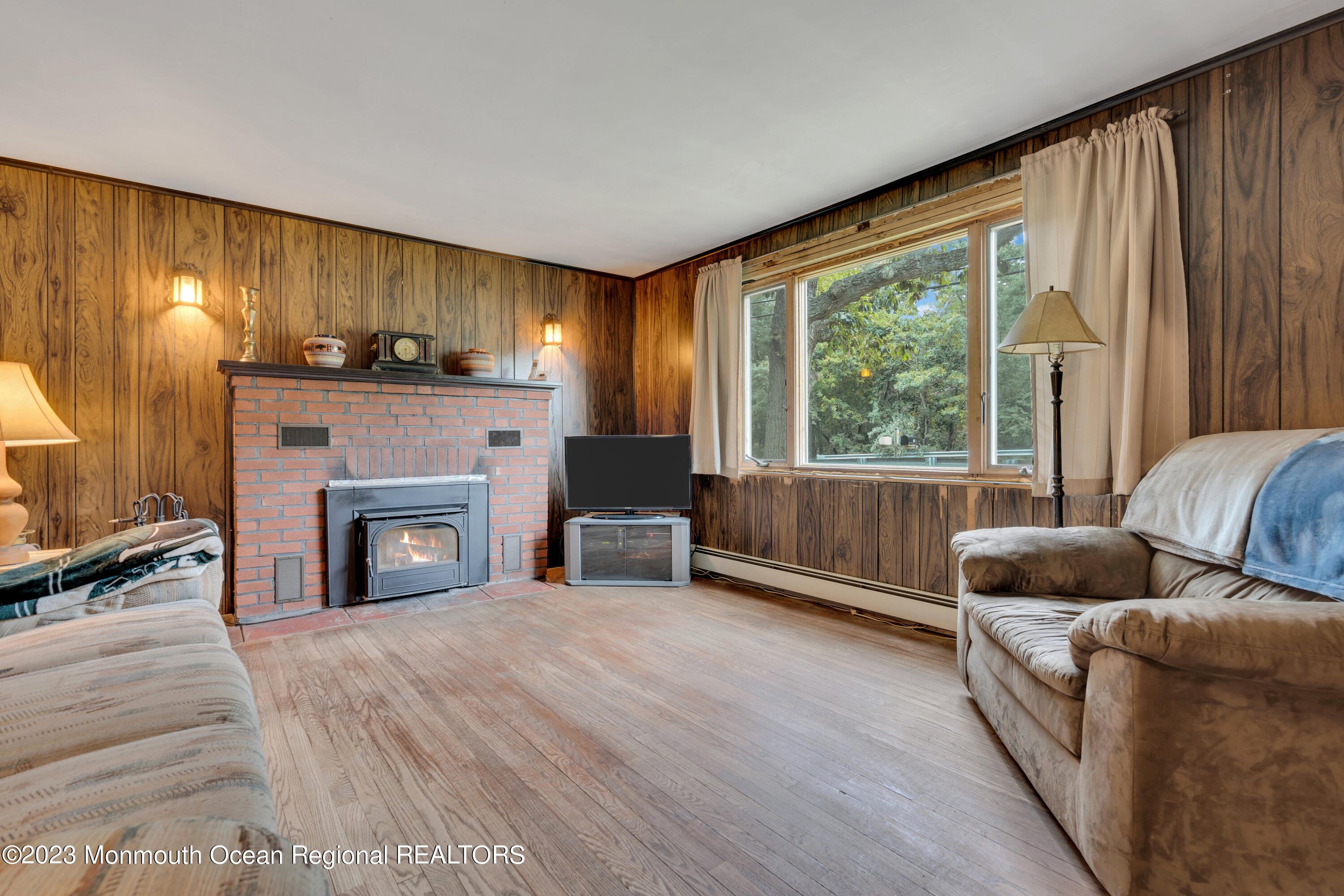 674 Harmony Road Jackson, NJ 08527 - Photo 6 of 43 a living room with furniture and a fireplace