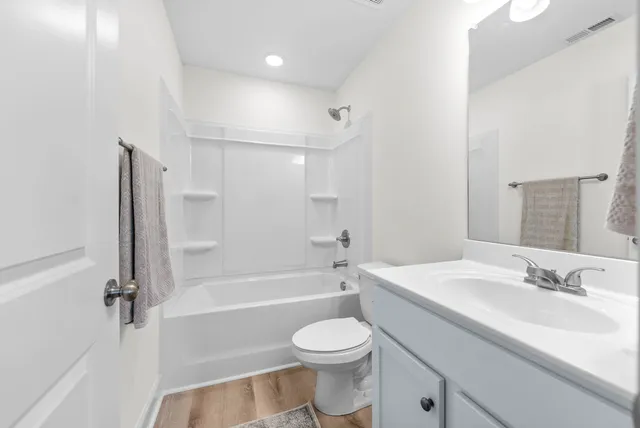a bathroom with a sink a toilet and a bathtub