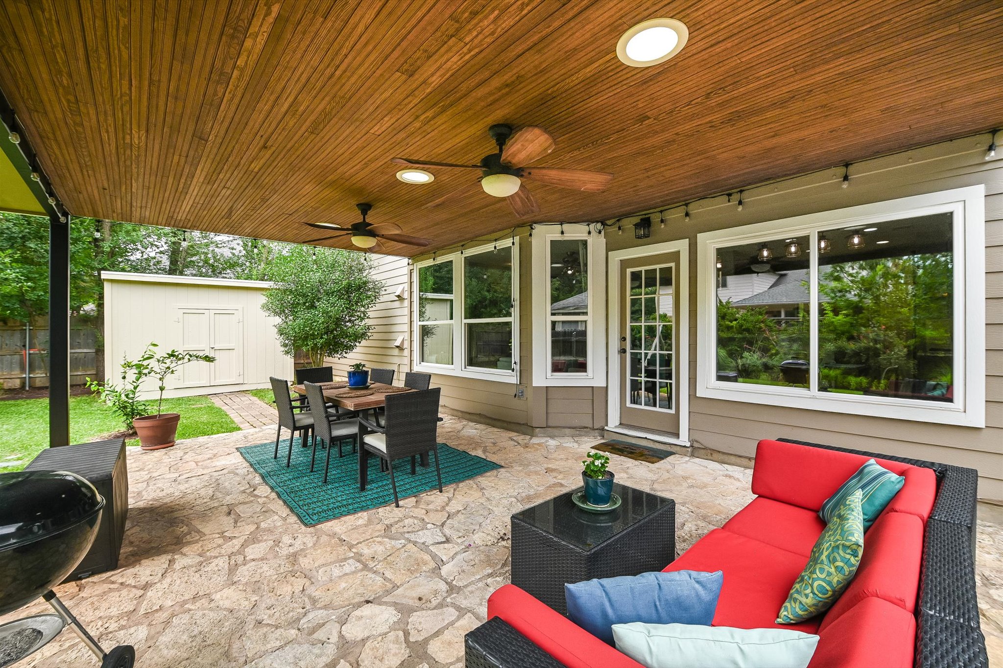 6456 Ruxton Lane Austin, TX 78749 - Photo 25 of 30 An inviting covered patio offers abundant space for outdoor dining and relaxation, complemented by a convenient shed for extra storage.