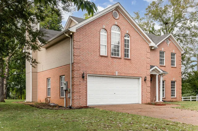 a view of a backyard of the house