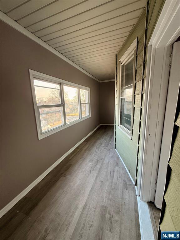 86 Hunter Street Lodi, NJ 07644 - Photo 13 of 15 a view of an empty room with wooden floor and a window