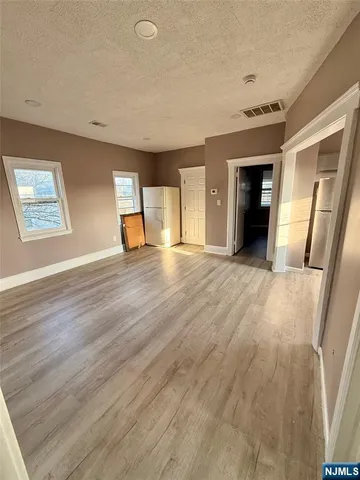 wooden floor in a room with a window