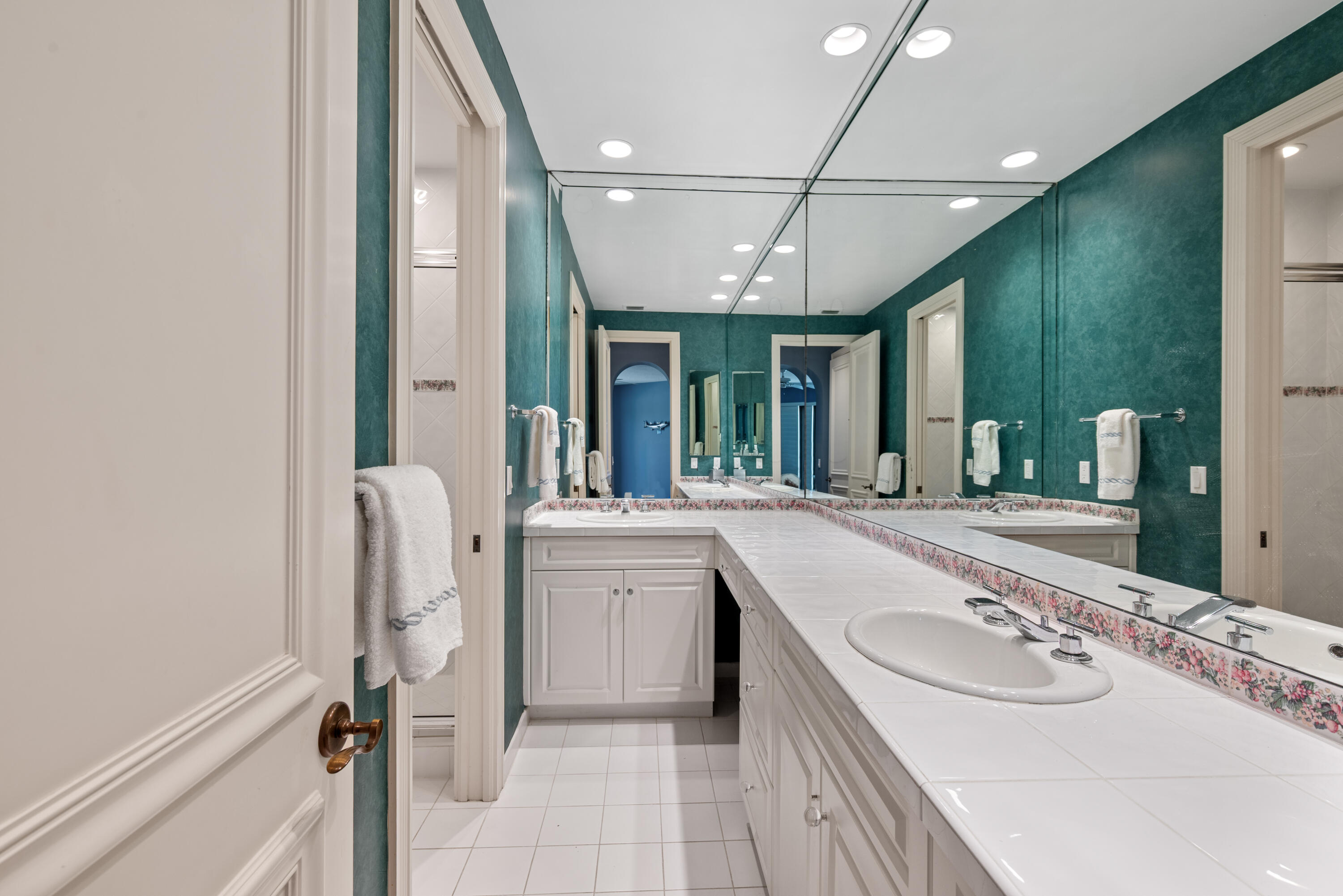 18800 Long Lake Drive Boca Raton, FL 33496 - Photo 41 of 60 a bathroom with a double vanity sink a mirror and a bathtub
