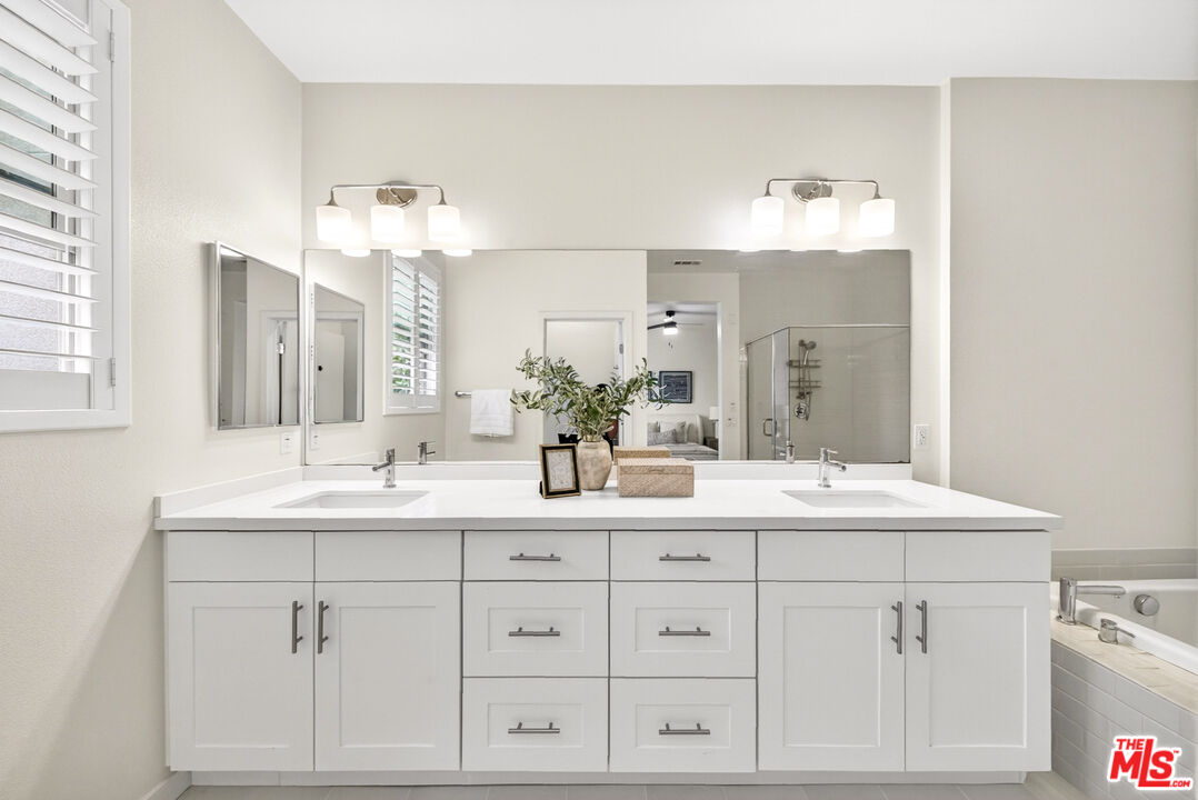 676 Colorado Circle Carson, CA 90745 - Photo 22 of 36 a bathroom with a sink vanity and mirror