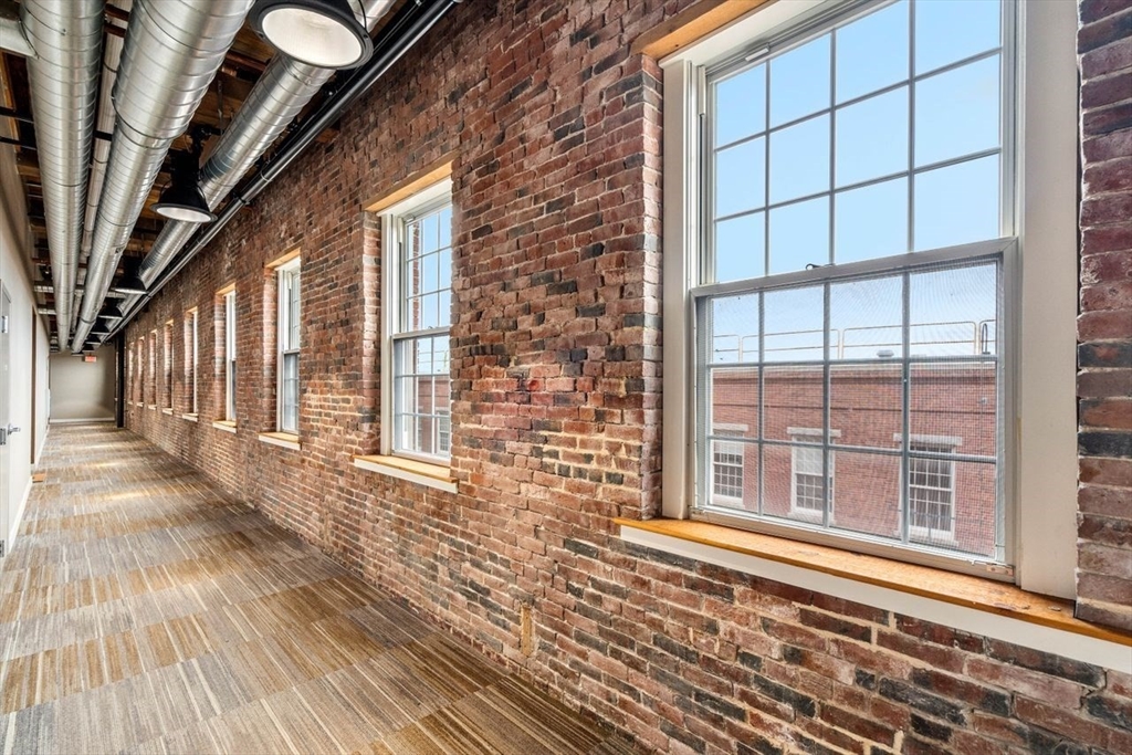 130 John Street, Unit 459 Lowell, MA 01852 - Photo 28 of 42 a view of a house with a large window