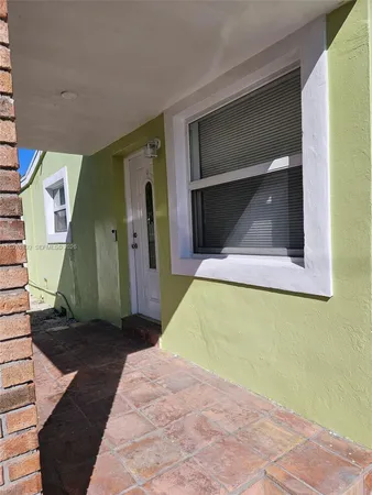 a bedroom with a bed and a mirror