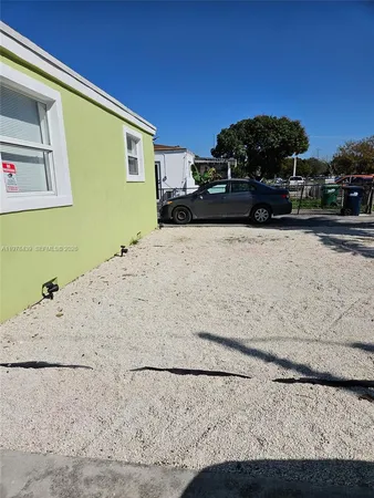 a view of car parked in front of a building