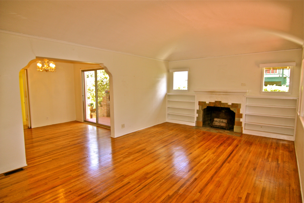 324 Arden Road Santa Barbara, CA 93105 - Photo 2 of 4 a view of empty room with wooden floor and fireplace