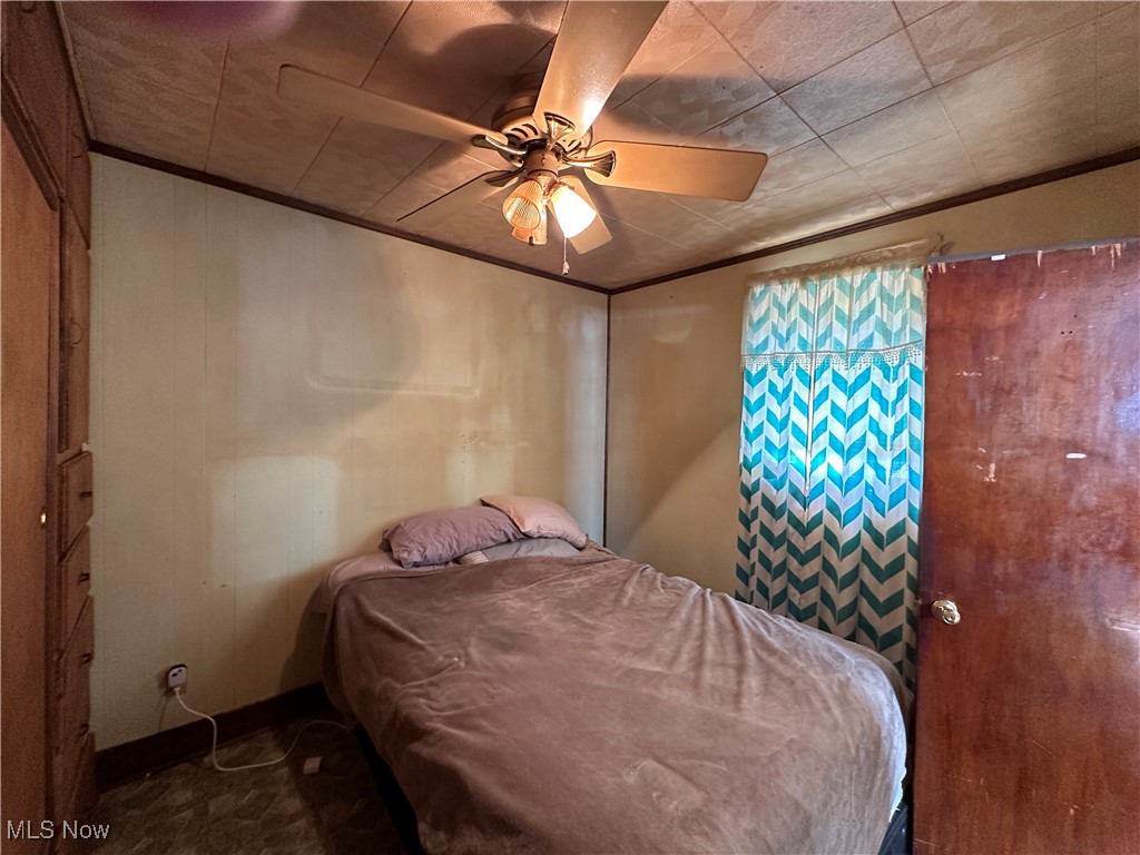 4058 Pardee Road Stow, OH 44224 - Photo 16 of 24 Bedroom with ornamental molding and a ceiling fan