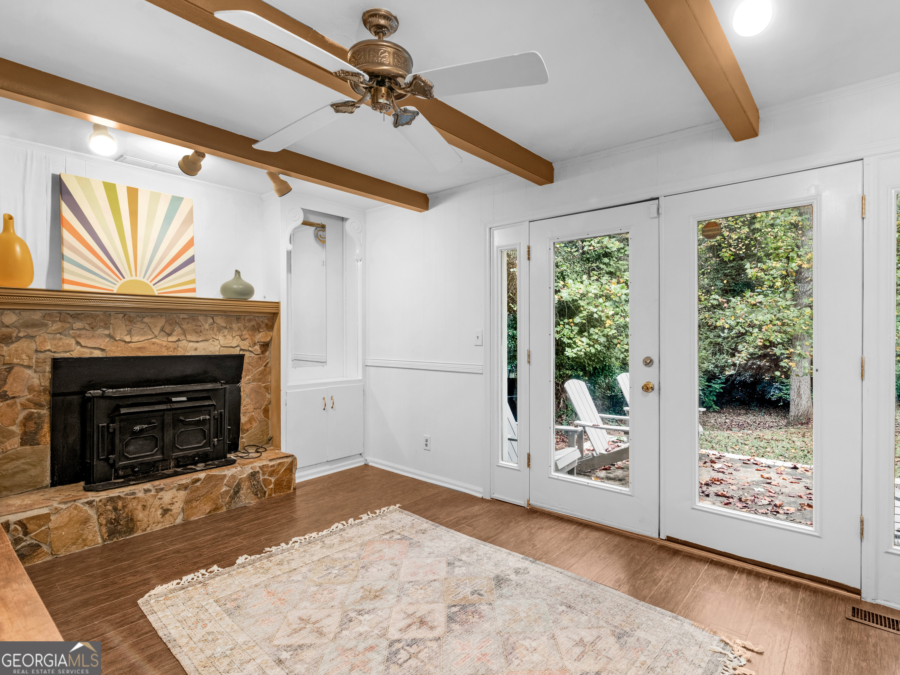 262 Rhodes Drive Athens, GA 30606 - Photo 11 of 21 a view of an empty room with wooden floor fireplace and a window