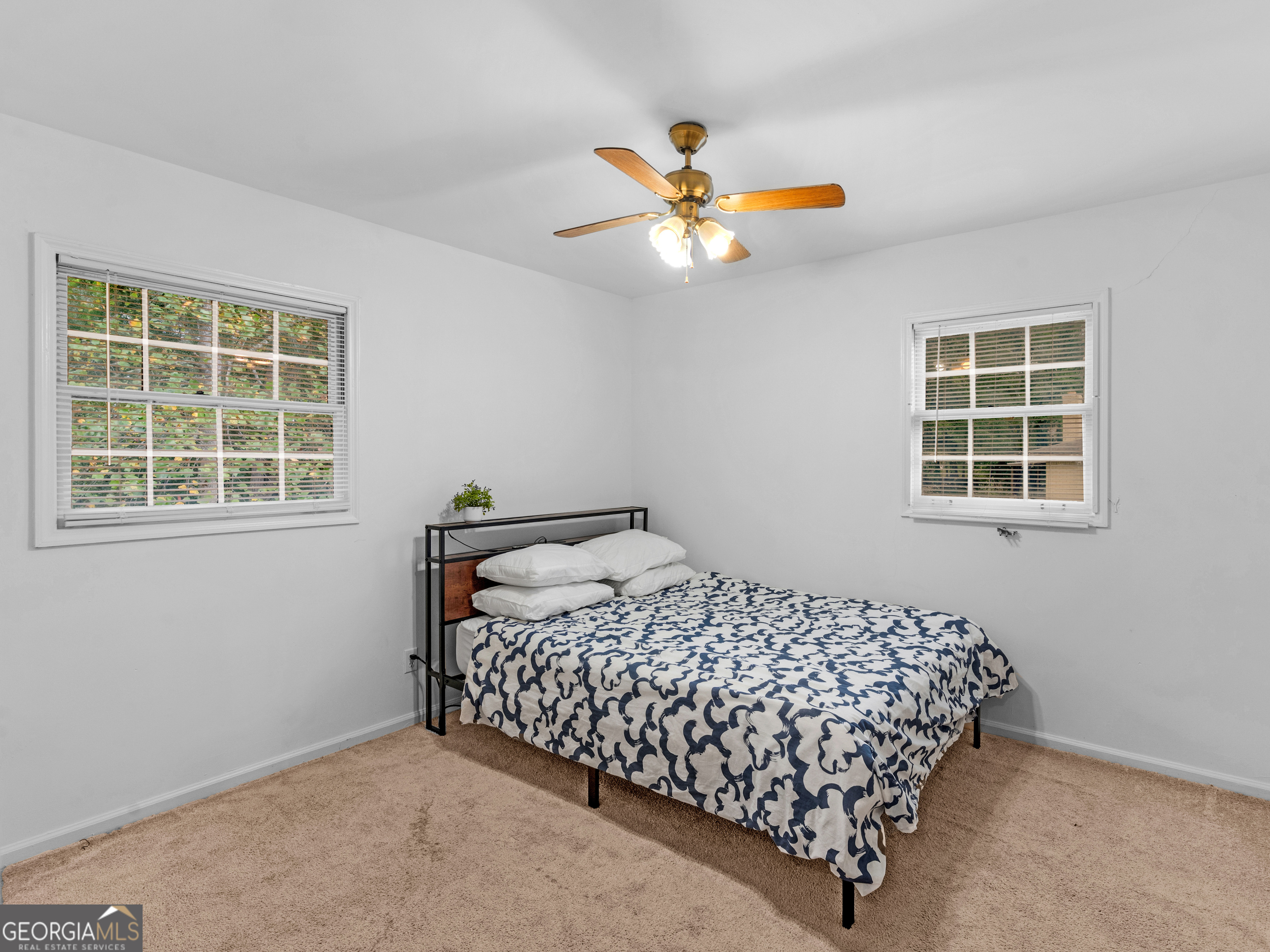 262 Rhodes Drive Athens, GA 30606 - Photo 14 of 21 a bedroom with a bed and window