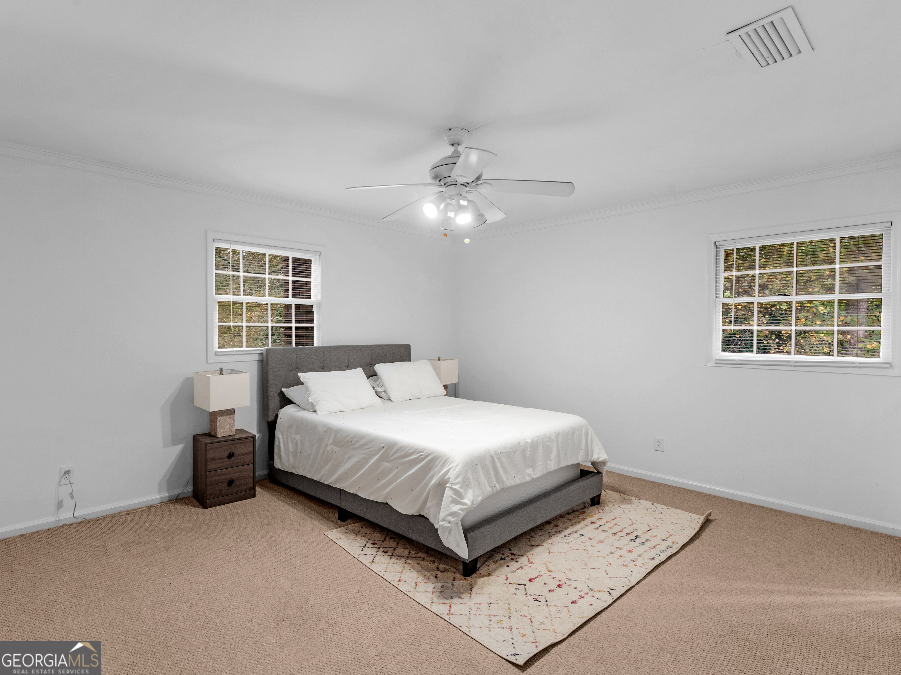262 Rhodes Drive Athens, GA 30606 - Photo 15 of 21 a bedroom with a bed lamp and a window