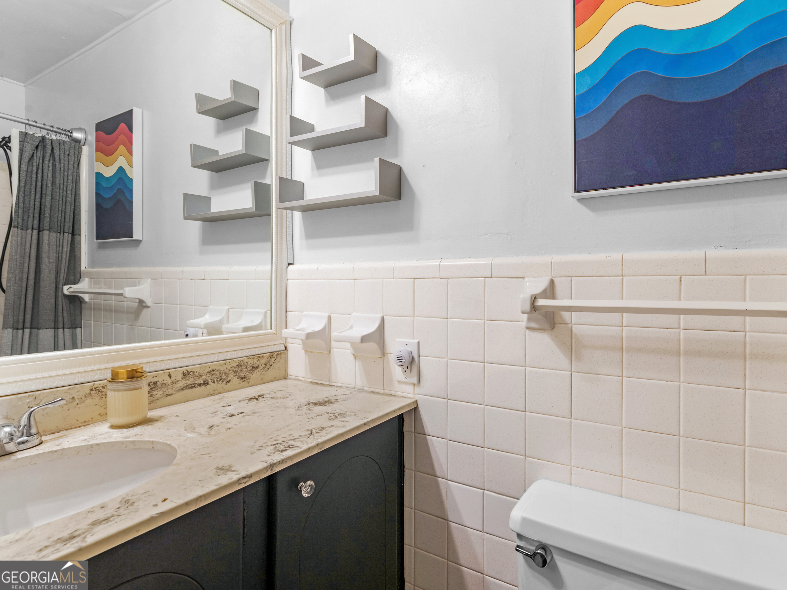 262 Rhodes Drive Athens, GA 30606 - Photo 16 of 21 a bathroom with a sink and a mirror
