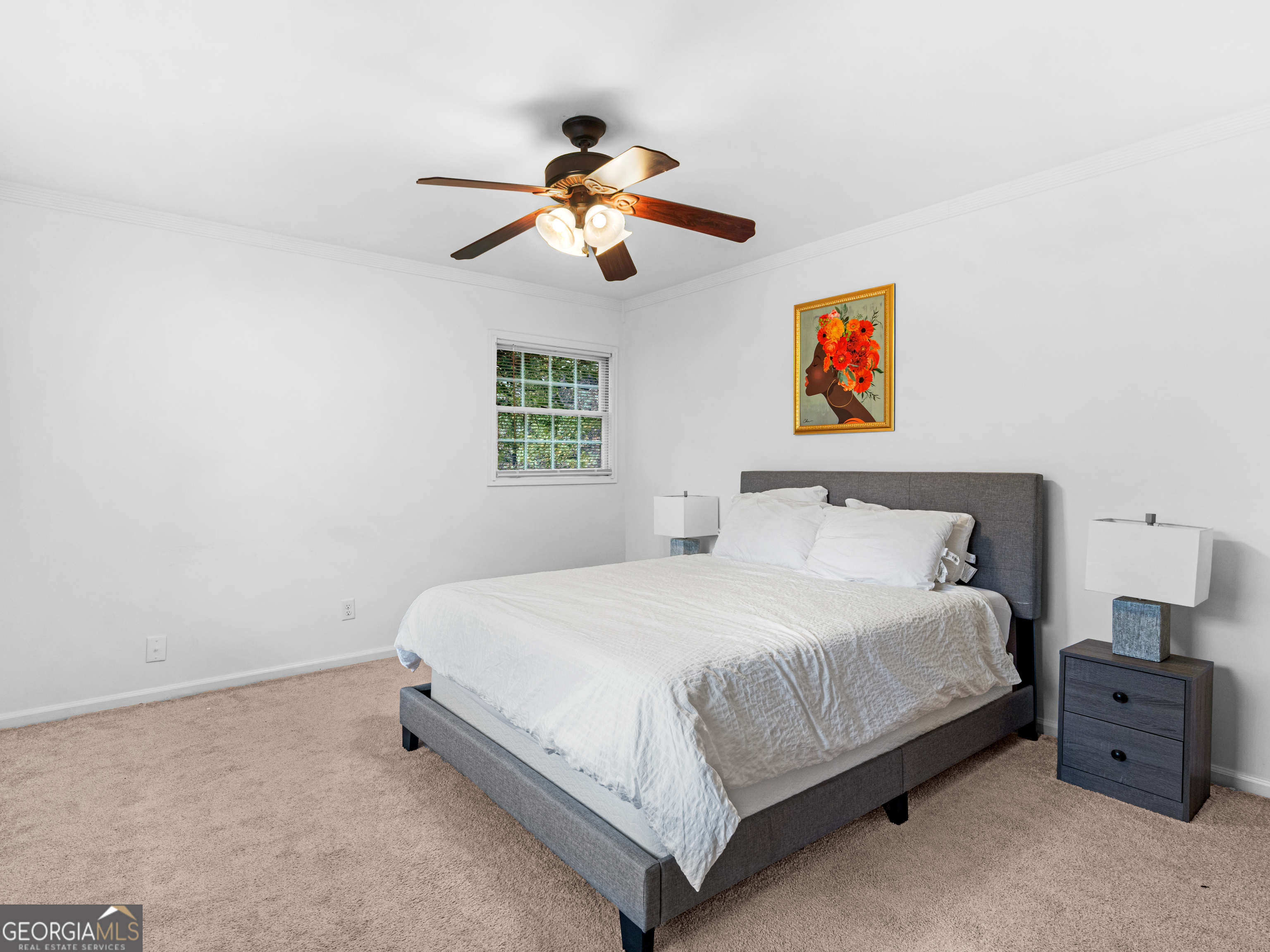 262 Rhodes Drive Athens, GA 30606 - Photo 17 of 21 a bedroom with a bed and a chandelier